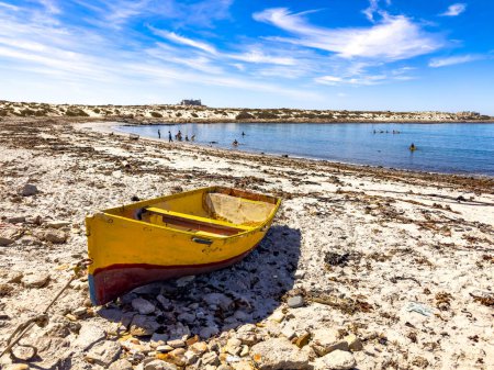  Small fishing rowboat on beach in small West Coast town of Port Nolloth, South Africa