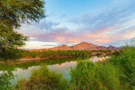 Sunrise over the Orange River in the Richtersveld National Park South Africa, with Namibia in the background, 