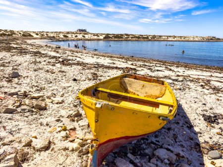  Small fishing rowboat on beach in small West Coast town of Port Nolloth, South Africa