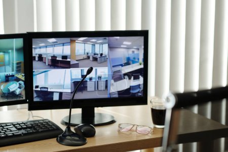 Photo for Monitors translating video from surveillance cameras in office - Royalty Free Image