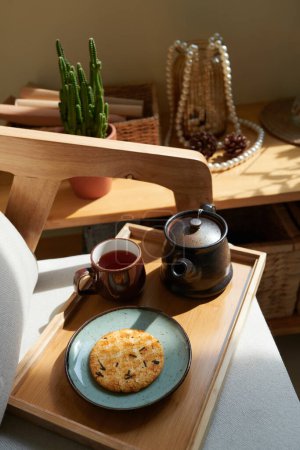 Photo for Wooden tray with cup of tea, teapot and plate with homemade sugar cookies - Royalty Free Image