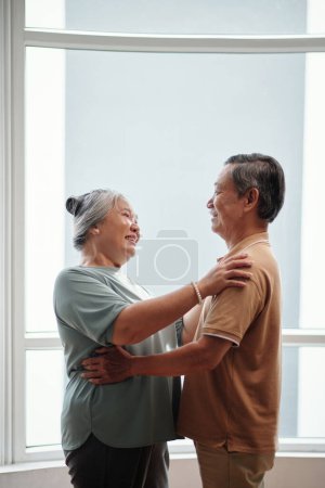 Photo for Smiling senior man and looking hugging and looking at each other, ove forever concept - Royalty Free Image
