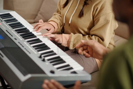 Photo for Hands of student playing electronic piano at music class - Royalty Free Image