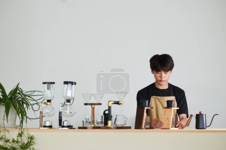 Photo for Barista making Vietnamese style coffee for client - Royalty Free Image