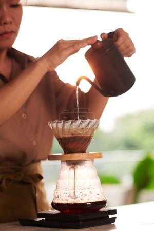 Photo for Barista making pour over coffee for customer - Royalty Free Image