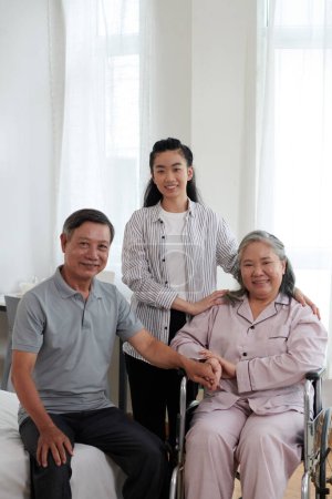 Photo for Portrait of smiling senior parents and adult daughter at home - Royalty Free Image
