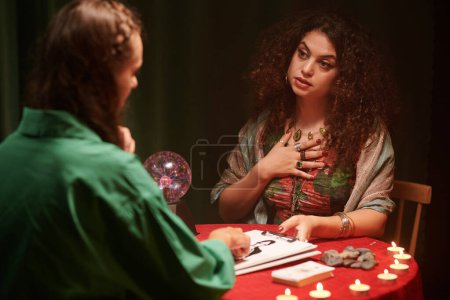 Photo for Seer talking to client, answering questions and giving advice - Royalty Free Image
