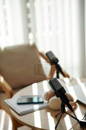 Photo for Professional microphones on table of podcaster in studio - Royalty Free Image