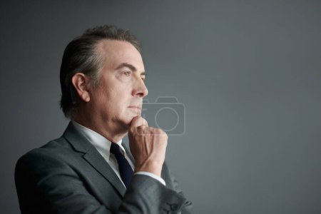 Photo for Portrait of entrepreneur pondering over ideas for business development - Royalty Free Image
