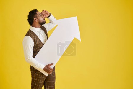 Photo for Businessman holding paper arrow pointing up, growth and development concept - Royalty Free Image