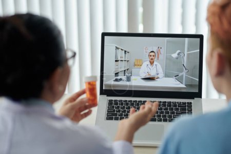 Photo for Medical workers discussing new medicine in online meeting - Royalty Free Image