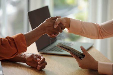 Photo for Closeup image of hr manager shaking hand of applicant before meeting - Royalty Free Image