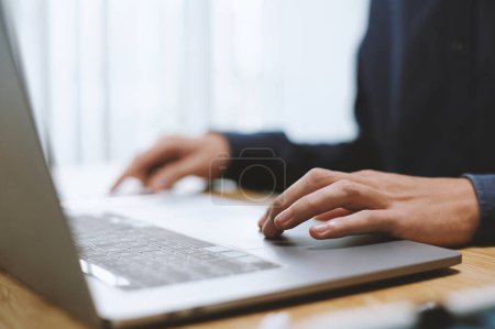 Photo for Hands of business person working on laptop at office desk, selective focus - Royalty Free Image