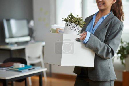 Photo for New company employee bringing belongings in office - Royalty Free Image