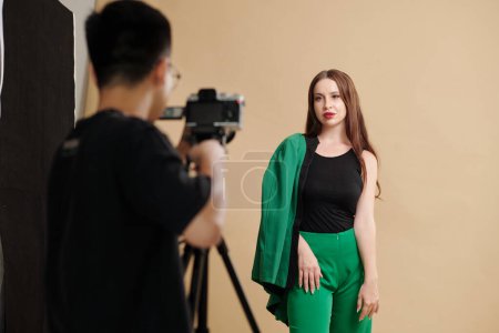 Photo for Fashion model in green suit posing for fashion catalog - Royalty Free Image