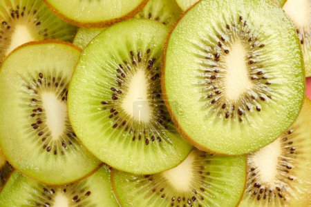 Photo for Pile of Thin kiwi slices, culinary and healthy eating concept - Royalty Free Image