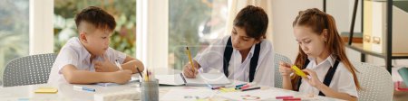 Photo for Website banner with group of school kids drawing at desk in class - Royalty Free Image
