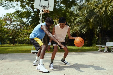 Photo for Joyful friends playing streetball after work - Royalty Free Image