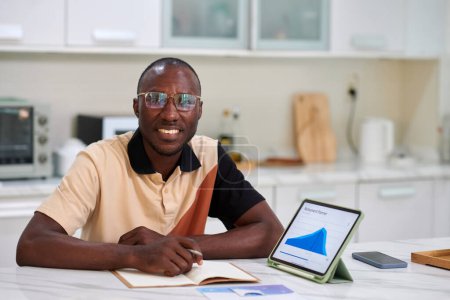 Photo for Portrait of smiling Black man creating retirement plan - Royalty Free Image