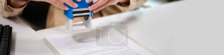 Photo for Web banner of bank manager sealing document, approving loan - Royalty Free Image