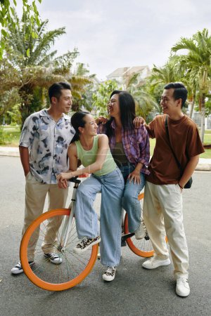 Photo for Two young Vietnamese couples enjoying double date - Royalty Free Image