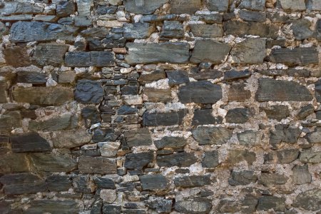 Photo for Architecture textures, detailed and rustic of paired schist masonry, traditional spanish and portuguese shist wall, typical iberian mix dark and light gray schist... - Royalty Free Image