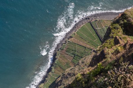 Photo for Fantastic aerial drone view at the Crane Viewpoint Girao Cape or Miradouro Cabo Giro, extreme point of the island and the sea crashing against the agriculture fields, Madeira Island, Portugal... - Royalty Free Image