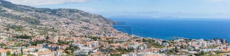 Photo for Madeira Island Portugal - 04 21 2023: Full panoramic aerial view of the city of Funchal and Camara de Lobos, tourist and iconic city on the island of Madeira, in Portugal - Royalty Free Image