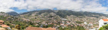 Photo for Madeira Island Portugal - 04 21 2023: Full panoramic view of the high lands on city of Funchal and Camara de Lobos, mountains as background, on the island of Madeira, in Portugal - Royalty Free Image