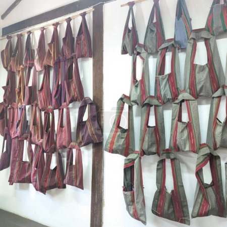 Thai silk neckerchiefs hanging on the wall of a shop