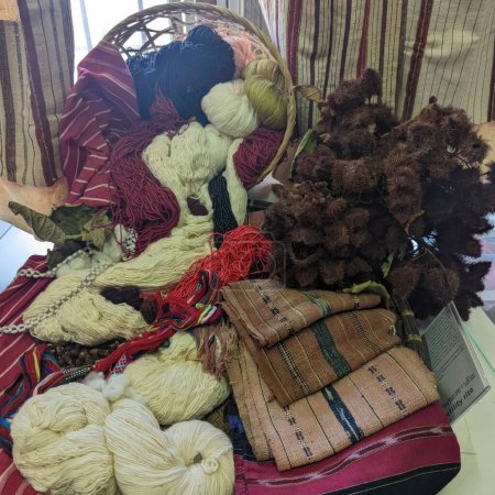 Wool yarn balls in a basket for sale in a shop.