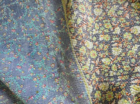 Texture, background, pattern. The fabric is knitted with a pattern of multi-colored threads.