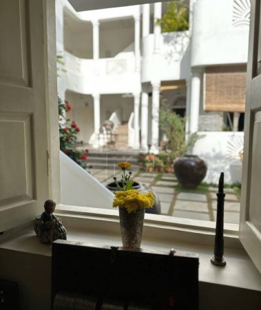 Interior of a house with flower vase on the windowsill