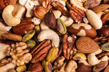Photo for Extreme close-up top view, a background with a large variety of shelled nuts. - Royalty Free Image