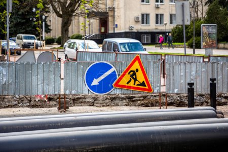 Photo for Road signs! Road works with trucks and traffic signs. road blocked signs and traffic is prohibited. - Royalty Free Image