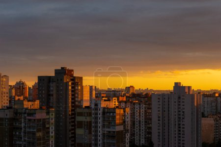 Photo for Sunset over soviet buildings of the Kyiv, capital of Ukraine - Royalty Free Image
