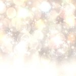 Winter background. A festive abstract Happy New Year or Christmas background texture with golden yellow blurred bokeh lights and stars. Space for design. Card concept or advertising.