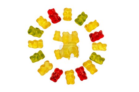 Photo for Gummy bears. Circle of fruity gummy bears with rainbow colors isolated on white. In the middle of the circle is a manufacturing error of gummy bears. Teddy bear circle. - Royalty Free Image