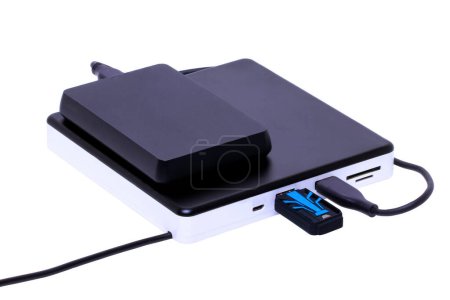 Photo for External DVD CD usb burner drive and player with integrated USB interfaces. (connected with hard drive and USB drive), SD TF and micro connections. Clipping path. Computer accessories. - Royalty Free Image