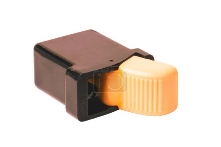 Vintage spare parts for cars. Close-up of a four-pole ivory-coloured button switch from the production of vehicle electrics in GDR times. Clipping path. Around 1960.