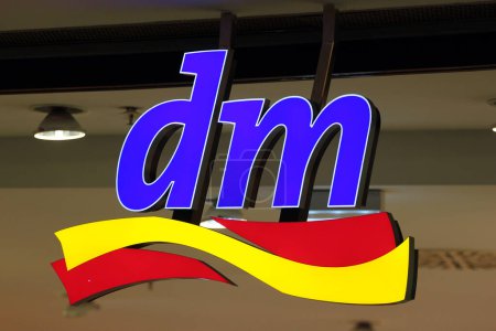 Photo for Chemnitz, Germany - June 12, 2023: Logo of Dm drogeriemarkt store. Headquartered in Karlsruhe, Dm-drogerie markt is a chain of retail drugstore chain for food, cosmetics, healthcare and household products - Royalty Free Image