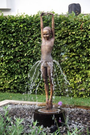 Photo for Dresden, Germany - June 27, 2023: Fountain with bronze sculpture Primavera II by Malgorzata Chodakowska, a Polish-born sculptor living in Dresden. - Royalty Free Image