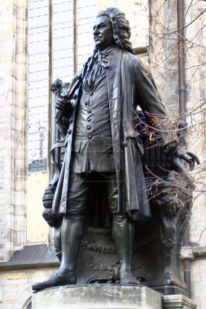 Photo for Leipzig, Germany - December 17, 2023: Monument to the famous German composer and organist Johann Sebastian Bach stands in front of St. Thomas church - Royalty Free Image