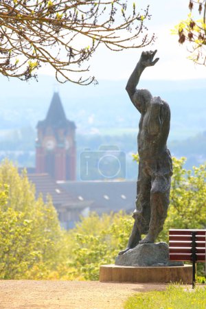 Photo for Plauen, Germany - May 14, 2023: Sculpture of Ascending Man by the German sculptor Fritz Cremer, located on Baerenstein hill near the Plauen main railway station - Royalty Free Image