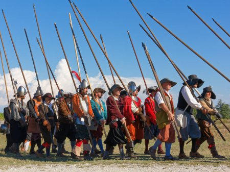 Photo for PALMANOVA, Italy - September 4, 2022: Reenactors parading after the battle during the Seventeenth Century annual historical reenactment - Royalty Free Image