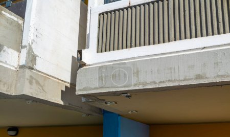 Téléchargez les photos : Balconies of condominium facade repaired after degradation and cracks in the reinforced concrete structure - en image libre de droit