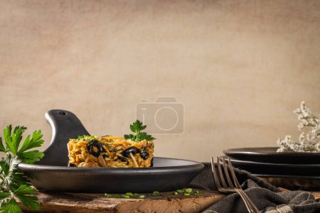Photo for Portuguese cuisine, Frango a Bras. Traditional Portuguese dishes, based on sauted chicken with onion, garlic, parsley, olives, egg and potatoes chips. A variation of the traditional Bras cod dish - Royalty Free Image