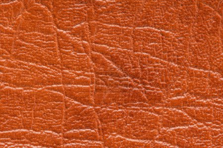 Photo for Brown artificial or synthetic leather background with neat texture and copy space, colorful fabric sample with leather-like finish aimed for upholstery, fashion, sewing or footwear projects - Royalty Free Image