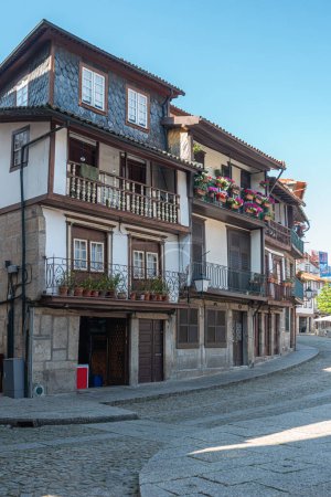 Photo for View of a narrow street in the old town of Guimaraes, Portugal - Royalty Free Image