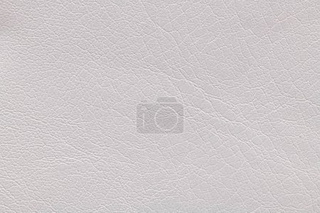 Photo for White artificial or synthetic leather background with neat texture and copy space, colorful fabric sample with leather-like finish aimed for upholstery, fashion, sewing or footwear projects - Royalty Free Image